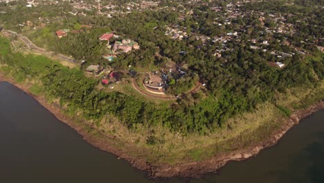 aerial-view-above-the-iguazu-river-with-a-view-of-hito-Tres-Fronteras-and-the-Iguazu-River-monument-in-South-America