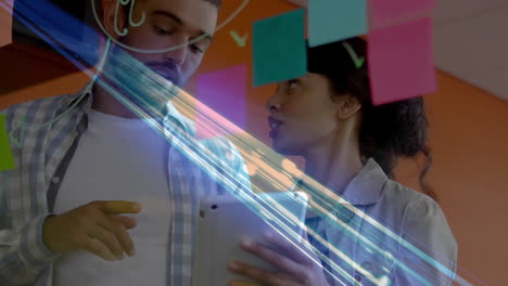 discussing ideas, two people with digital animation over sticky notes in school