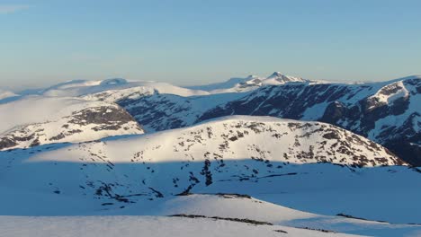 Drone-shot-from-the-arctic-mountains-top-covered-in-snow