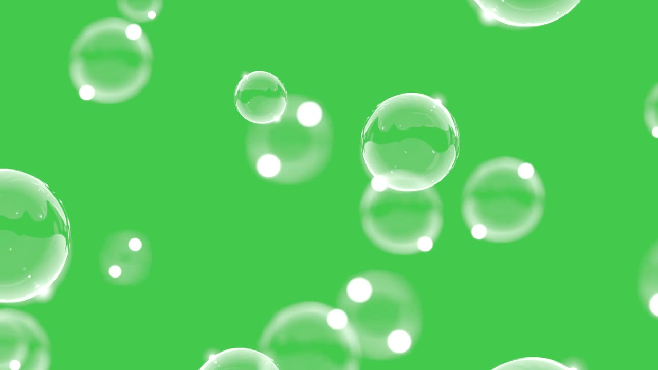burbujas de jabón abstractas volando con un fondo de pantalla verde. varias burbuja de aire en el agua que se eleva.