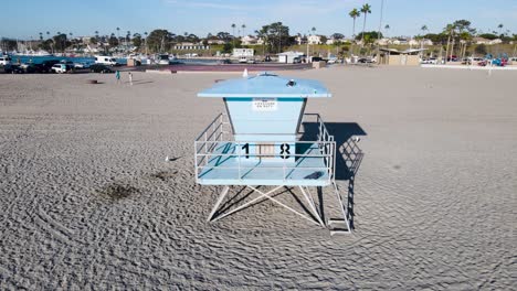 Lifeguard-tower-18,-aerial-pan,-oceanside-harbor