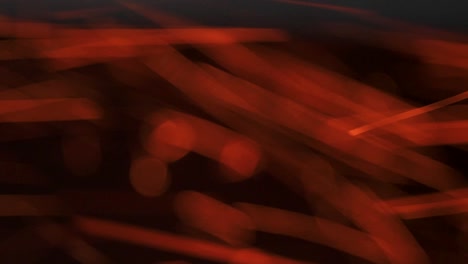 burning sparks from a fire in a black planted pipe. abstraction