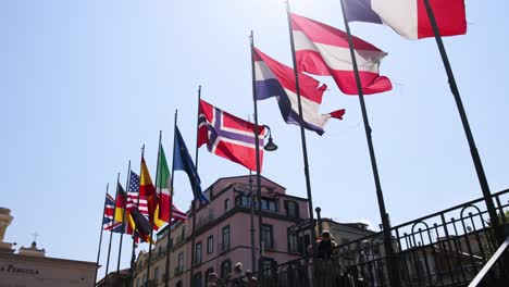multiple flags waving in the wind