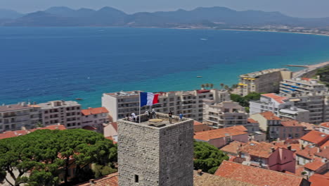 cannes france aerial v35 low level drone flying around chateau de la castre, medieval watchtower capturing surrounded cityscape and old port - july 2021