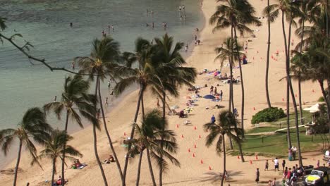 tourists on the beach at hanauma bay, hawaii kai neighborhood of east honolulu, oahu