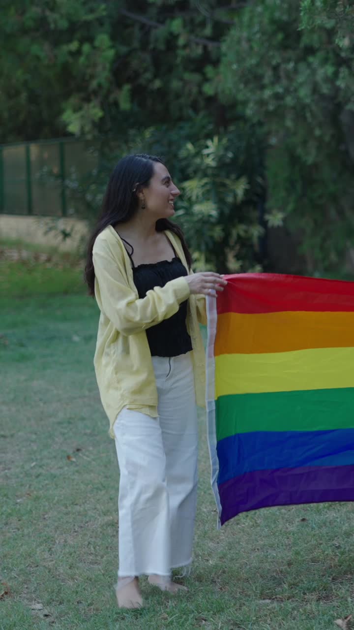Images of people holding pride flags