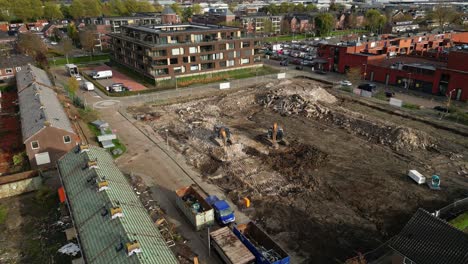 heavy machinery demolishing debris and turning it into finer gravel