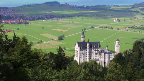 neuschwanstein castle in schwangau, germany overlooking valley near the alps