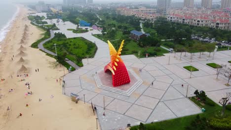 drone obit around crowded sandy beach in nanhai district high technology area in weihai, shandong province in south china