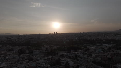 sideways drone shot above arequipa peru during sunset with a view above the city log