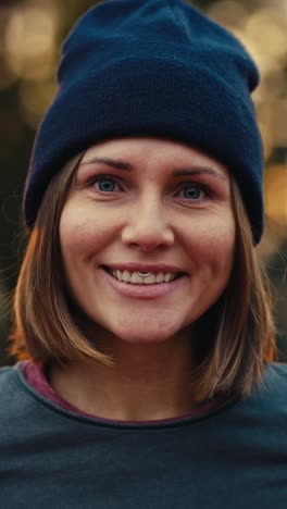 woman smiling in a beanie