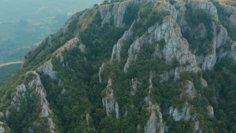 aerial view of steep cliffs of mucanj mountain, western serbia on summer day