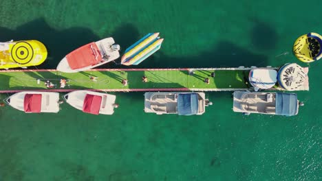 a drone fotage of a tropical dock whit boats in 4k