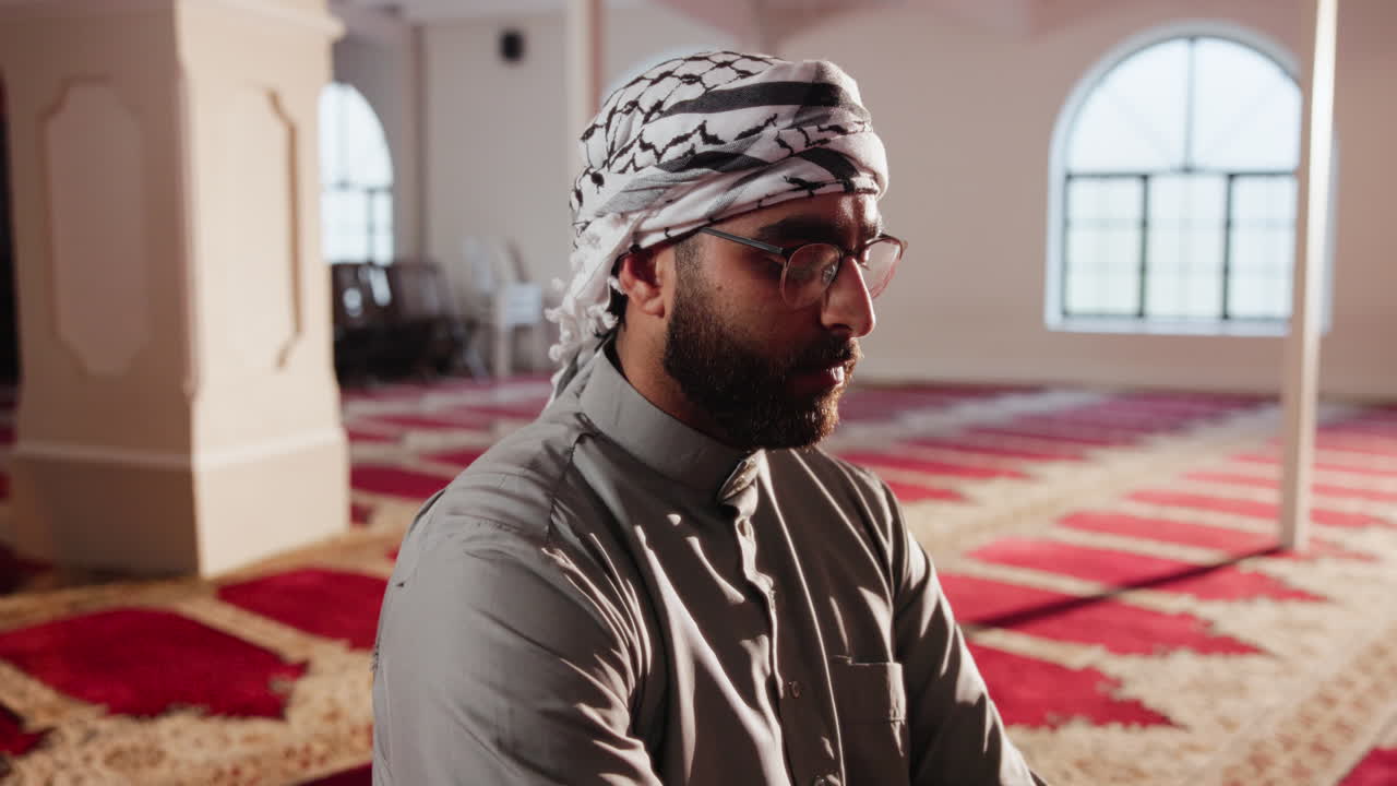 Muslim man praying in a mosque