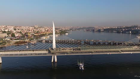 istanbul metro subway train arrives at station on golden horn bridge in turkey's largest city