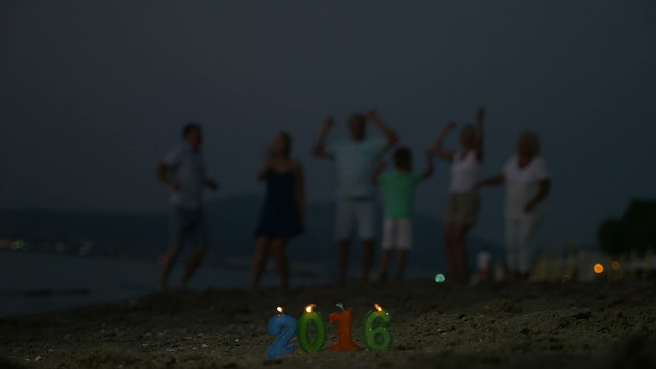 Family party on the beach to celebrate New Year 2016