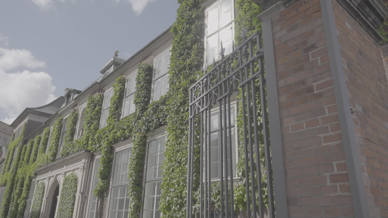 Art District Charlottenburg building full of plants in Copenhagen Denmark on a cloudy day LOG