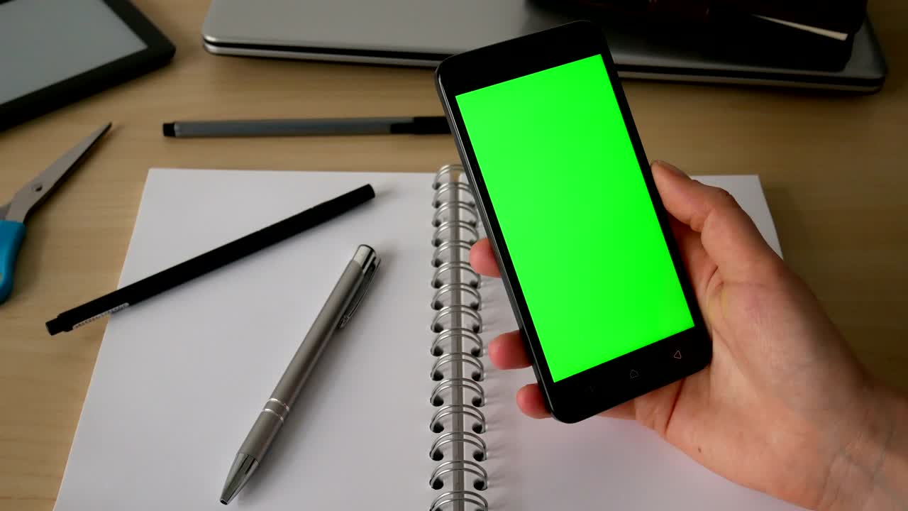 Business woman using a Smartphone Touchscreen. Fingers make gestures touching and swiping the screen of a modern smartphone.