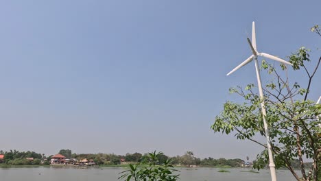 wind turbine blades rotating against a clear sky