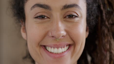 Portrait-mixed-race-woman-with-dredlocks-smiling