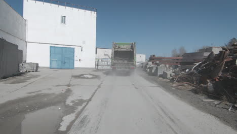 garbage truck at a recycling and demolition site