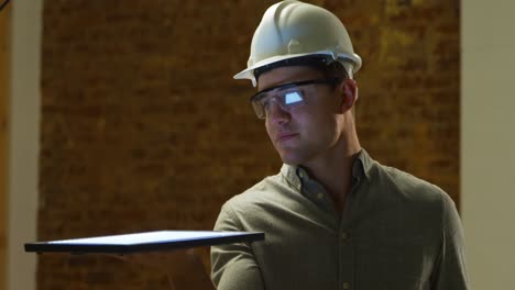 young architect holding a tablet