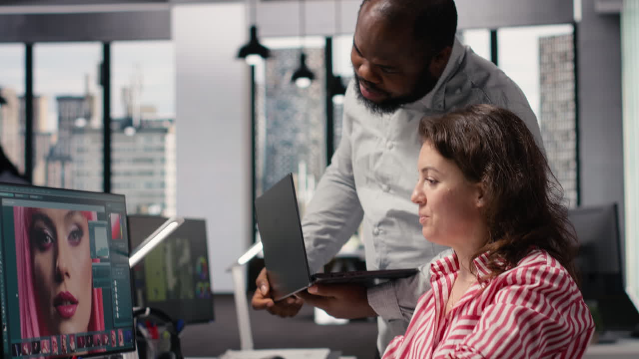 Creative Professionals Collaborating on Photo Editing Project in Modern Office