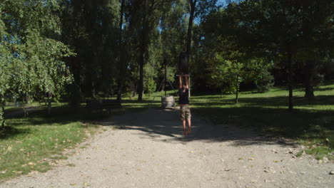 a boy going down a ropeway in a children's park