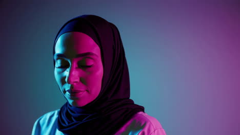 woman in hijab neon portrait