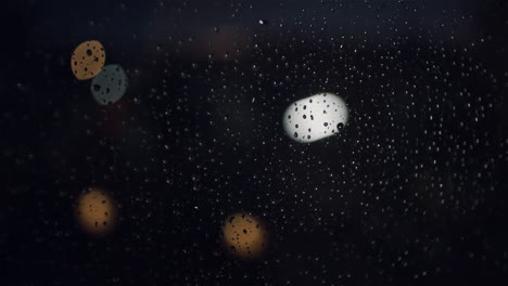 rainy-night-closeup-of-raindrops-on-the-window-with-nice-bokeh