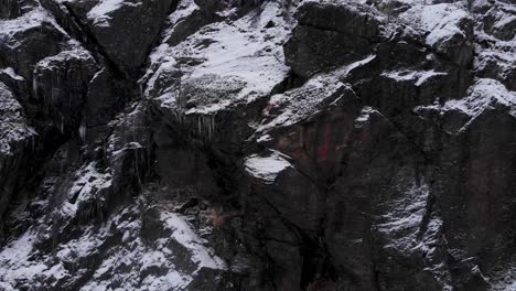 Frozen-eerie-stone-wall-in-the-cold-landscape-of-the-Swedish-Scandes---Aerial-pull-out