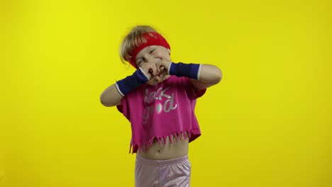 Little-energetic-caucasian-girl-in-pink-sportswear-making-fit-dance,-modern-aerobic-dancer