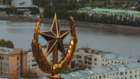 golden star monument on a building