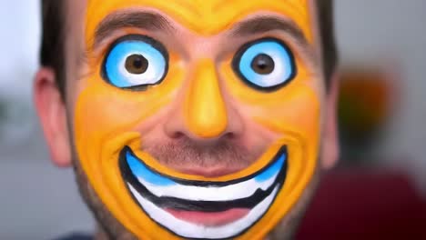 man with painted clown-like face