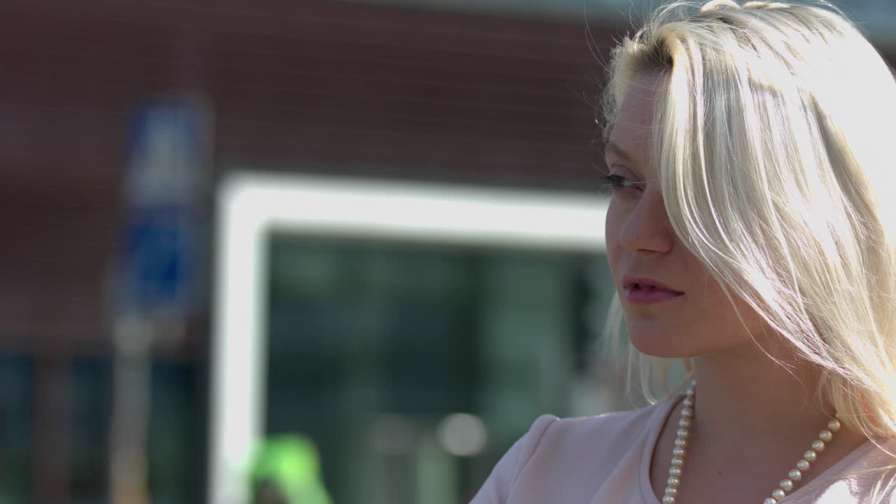 Close up of Blonde woman thinking deeply sign of problems or depression with copy space city background. Businesswoman having problem with her business looking sad with unhappy face