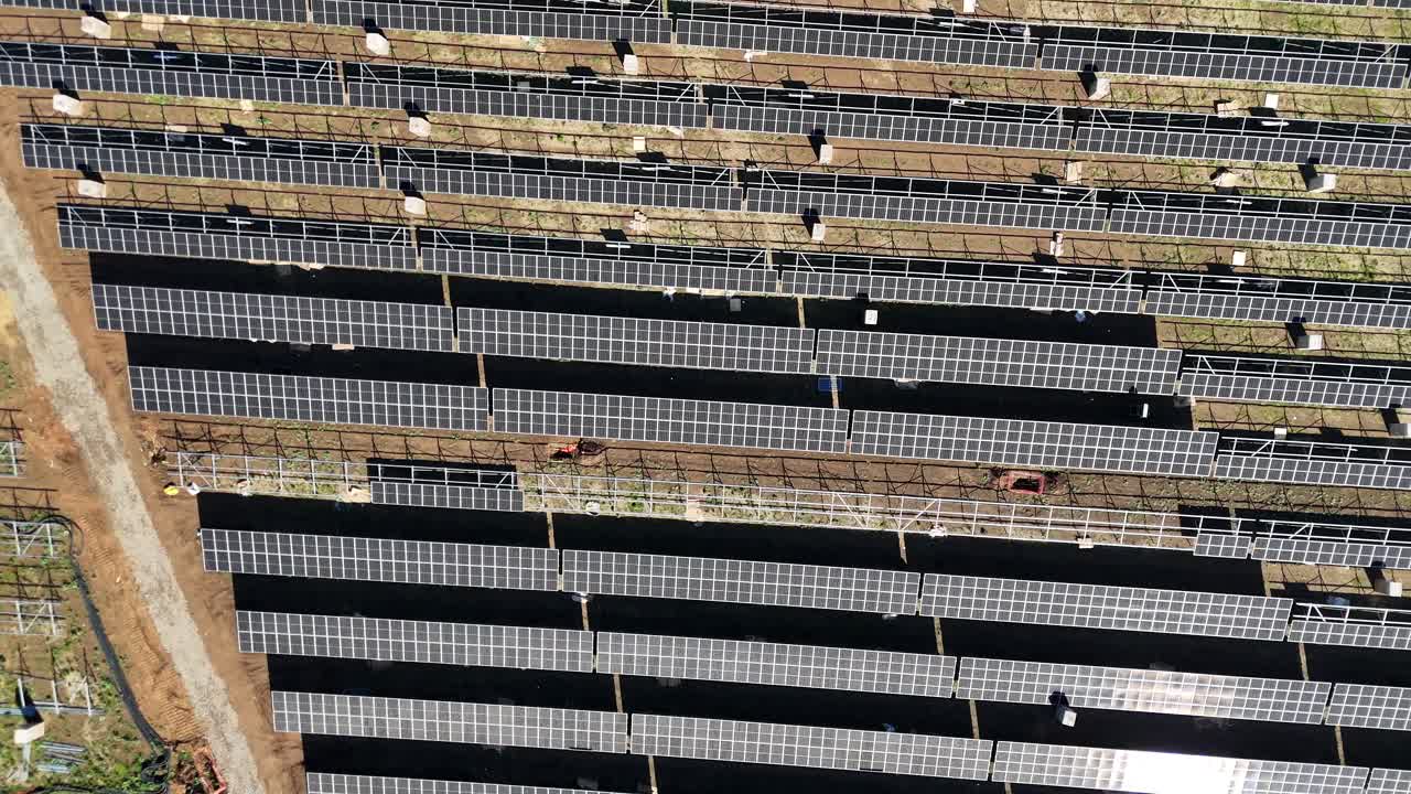 Birds eye view drone aerial Rows of solar farm renewable energy panels photovoltaic green grid sustainable clean power plant eco natural resources