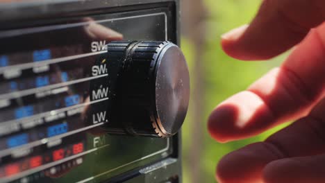 old retro am fm radio with tubes, hand changing stations , bulb vintage music player.