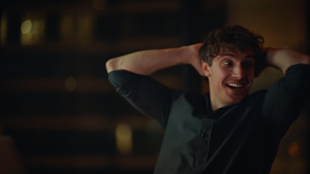 Excited freelancer working late reading great news at laptop closeup. Happy man