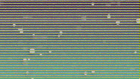 digital animation of tv static effect over multiple face emojis floating on green background