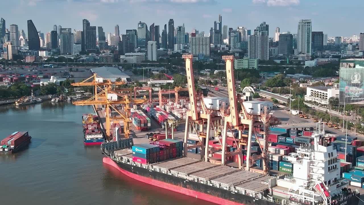 View of Bangkok's busy port with containers and city skyline