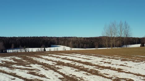 drone footage of rural fields during early spring