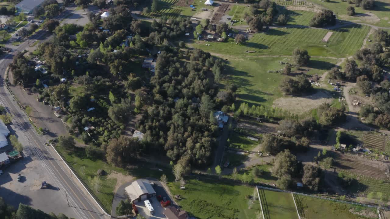 Beautiful aerial over farm town road during a gorgeous sunrise