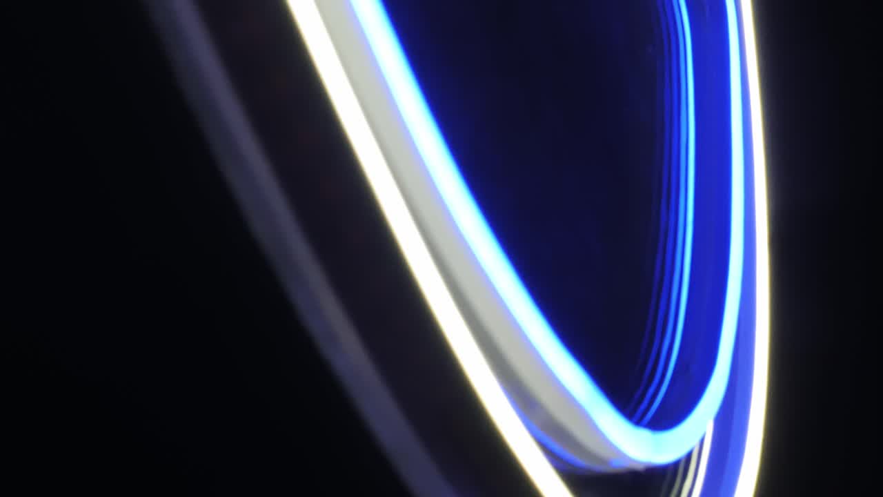 Glowing LED ring with blue and white light creates sleek futuristic night visual