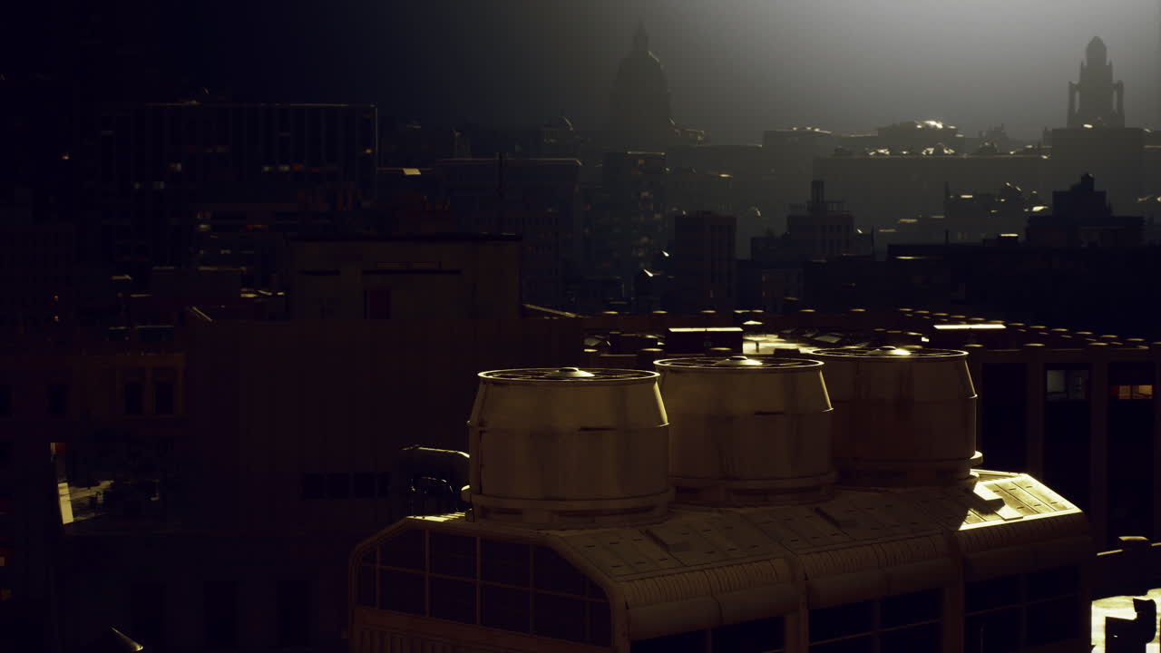 City skyline at night with industrial rooftops illuminated by moonlight