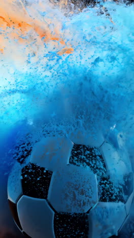 a soccer ball is surrounded by a cloud of smoke. the smoke is orange and blue, and the ball is white. the scene is chaotic and disordered, with the ball and smoke swirling around each other