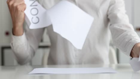 businesswoman sitting at table and tearing up paper contract closeup 4k movie slow motion