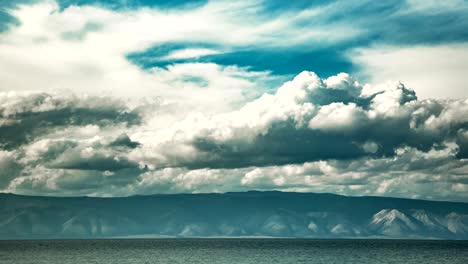 a white clouds moving over the shore of lake baikal