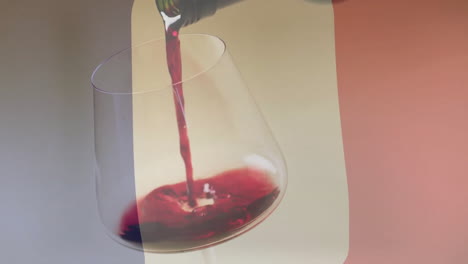 composite of red wine being poured into glass over flag of france background