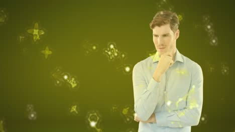 animation of caucasian man wearing a shirt and touching molecules models floating on yellow backgrou