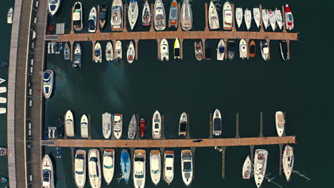 top view of drone flying above the marina with moored luxury yachts in sopot, poland